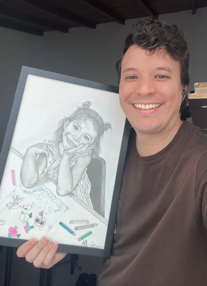 David y Estefanía con el retrato a grafito de su hija Gabriela